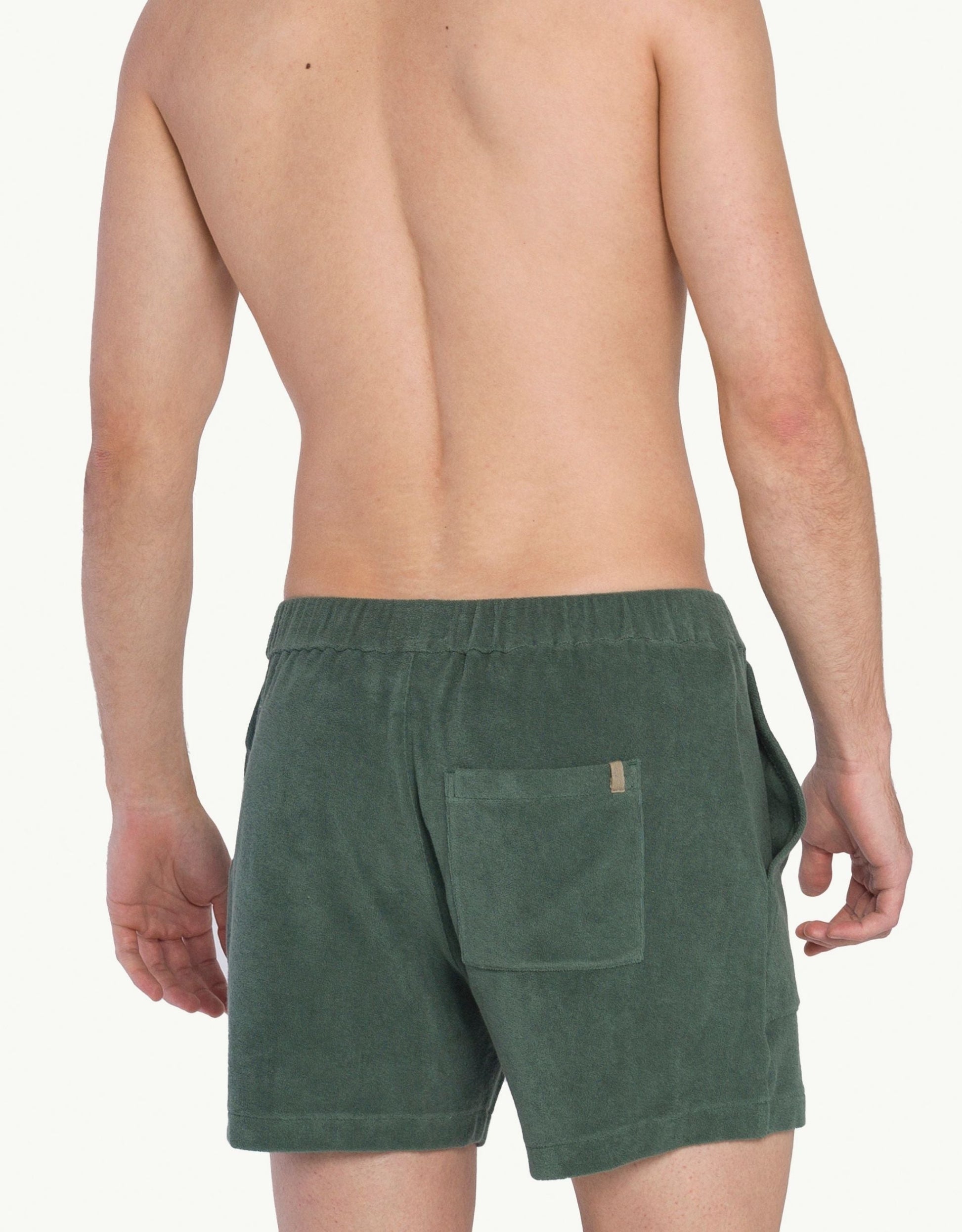 Versatile summer luxury shorts with a towel-like feel, ideal for beach getaways or nights out. Made from 100% certified organic cotton in green.