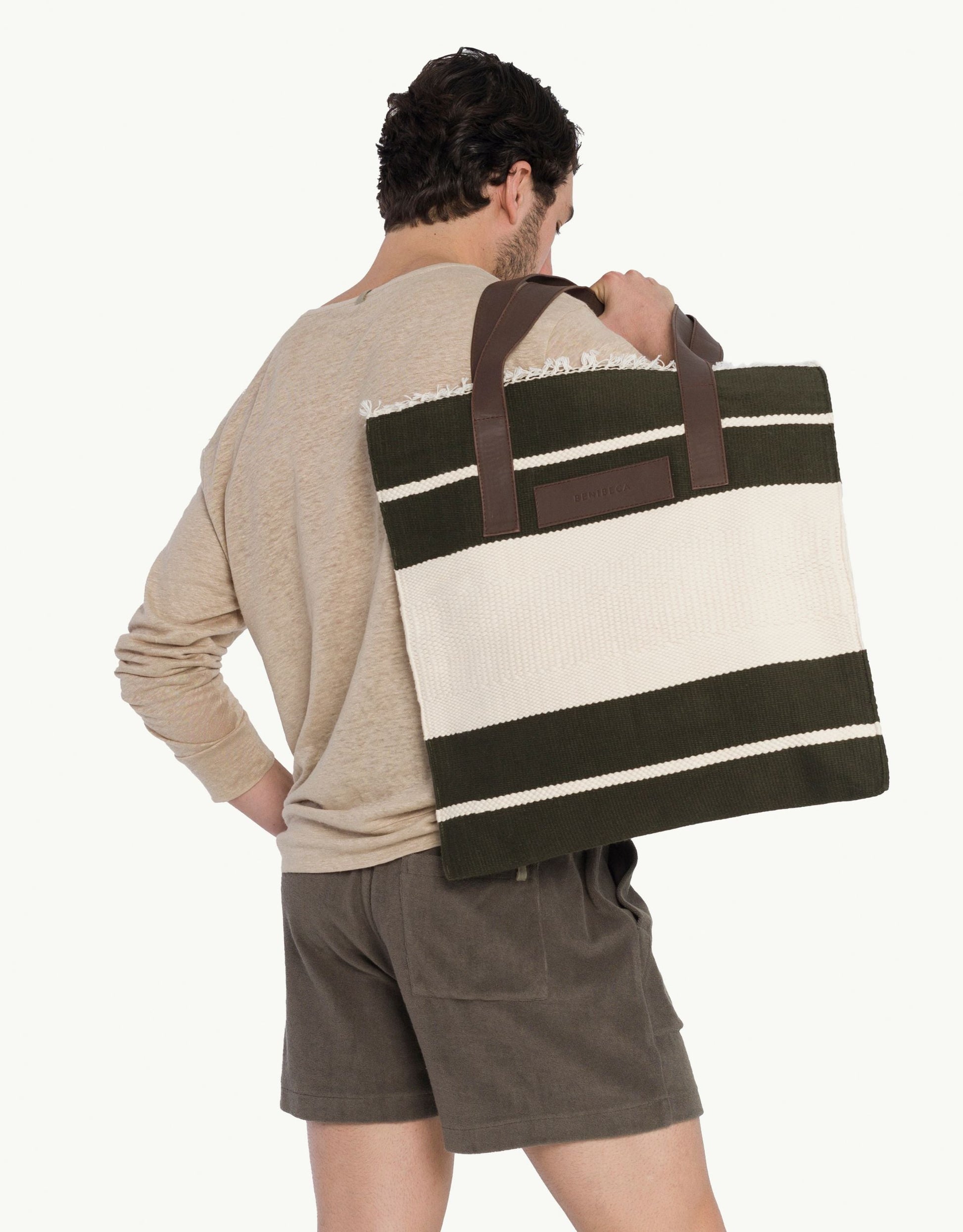 Explore our handcrafted tote bag, inspired by Peruvian artisanship. This two-tone cotton weave tote showcases naturally tanned crust cowhide and tocuyo cotton lining, complete with dual compartments and pockets for practical elegance. Browse our selection of Peruvian artisan tote bags.