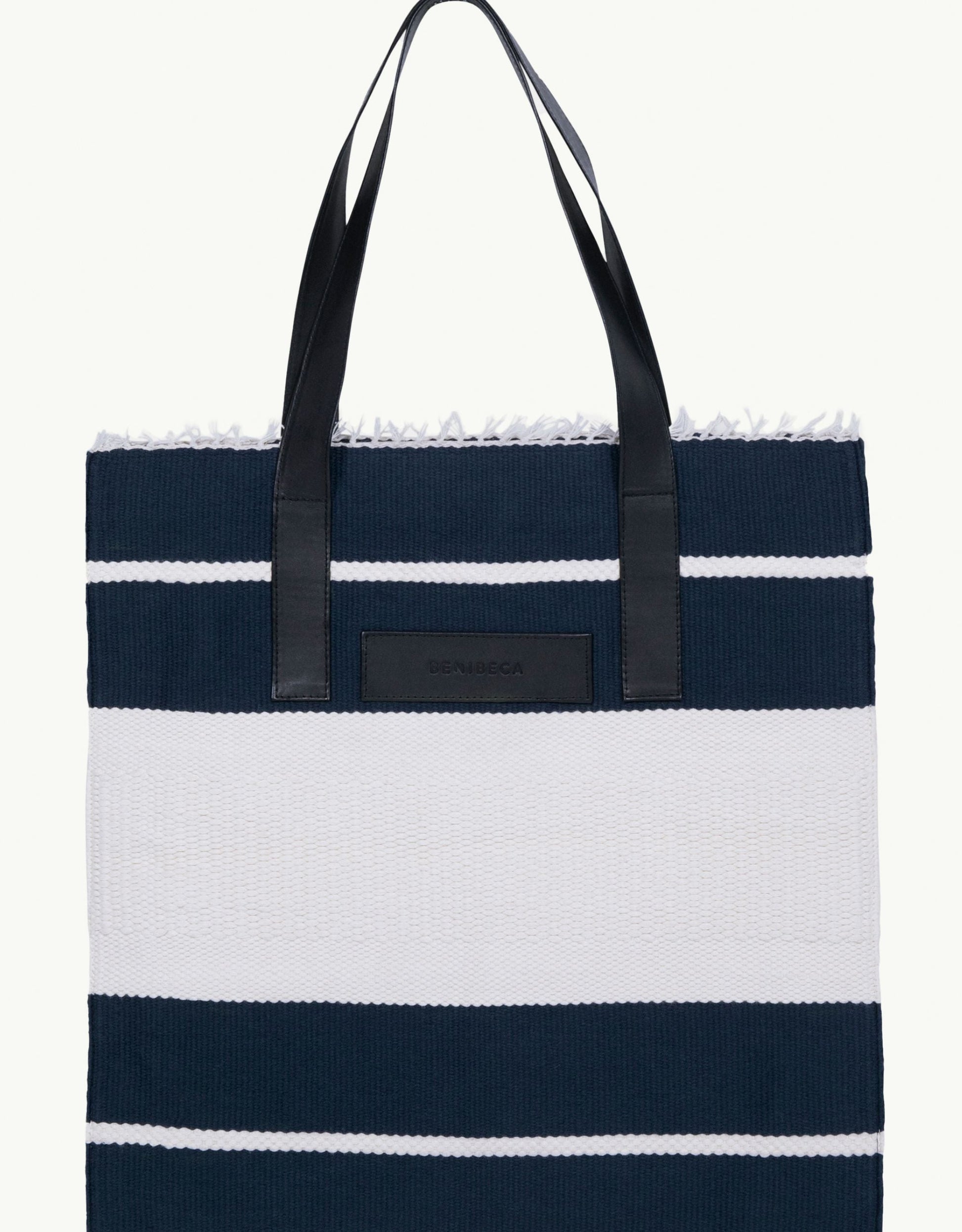 Explore our handcrafted tote bag, inspired by Peruvian artisanship. This two-tone cotton weave tote showcases naturally tanned crust cowhide and tocuyo cotton lining, complete with dual compartments and pockets for practical elegance. Browse our selection of Peruvian artisan tote bags.