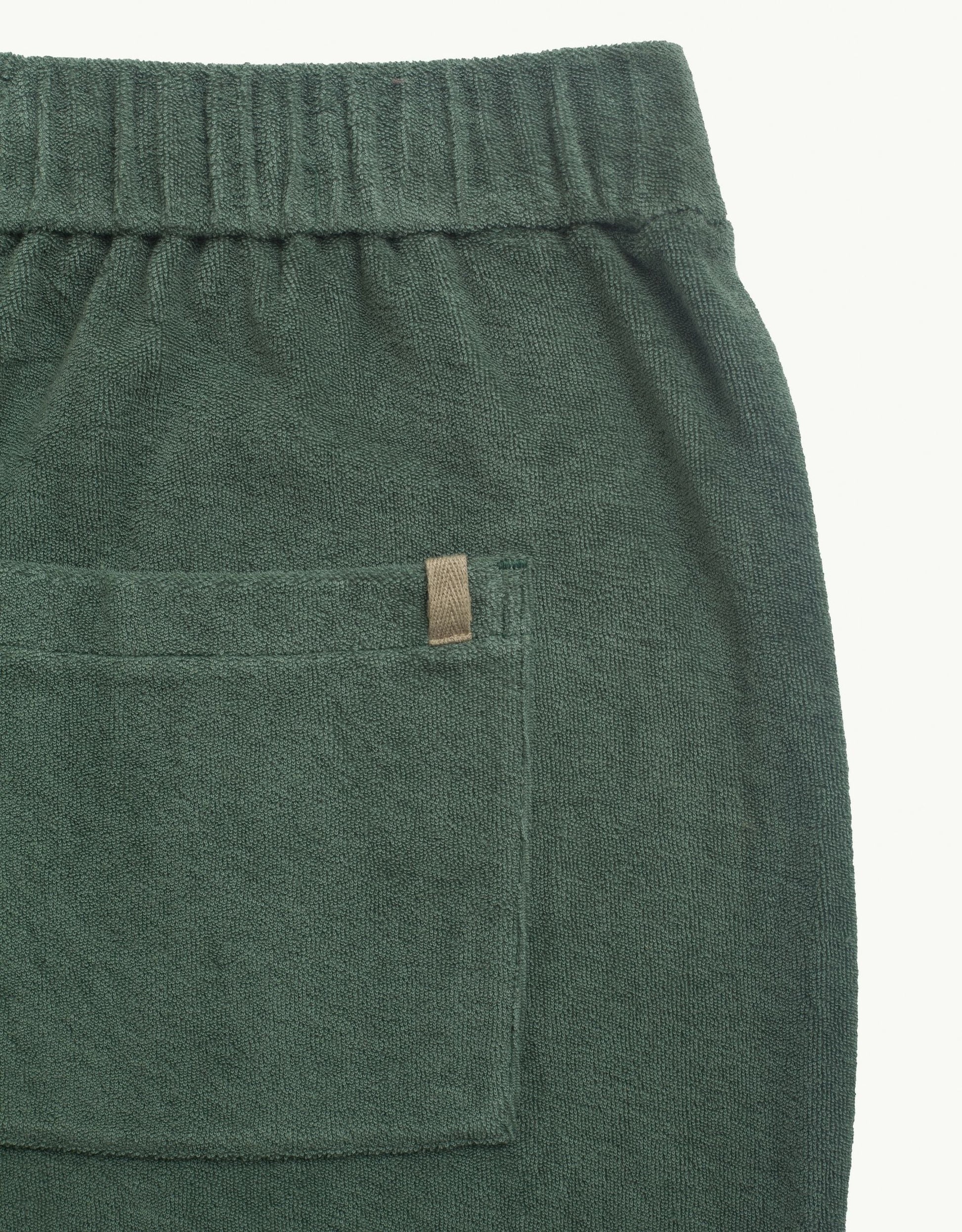 Versatile summer luxury shorts with a towel-like feel, ideal for beach getaways or nights out. Made from 100% certified organic cotton in green.